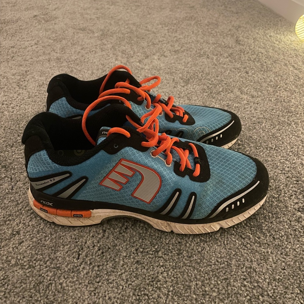 Blue and Black Athletic Shoes with Orange Accents